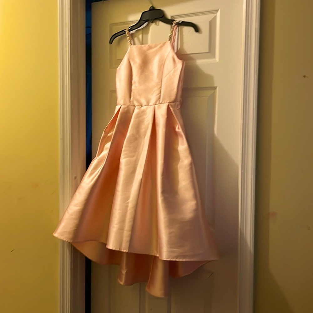 Like new Soft peach dress with gems on the  straps . This dress also has pockets